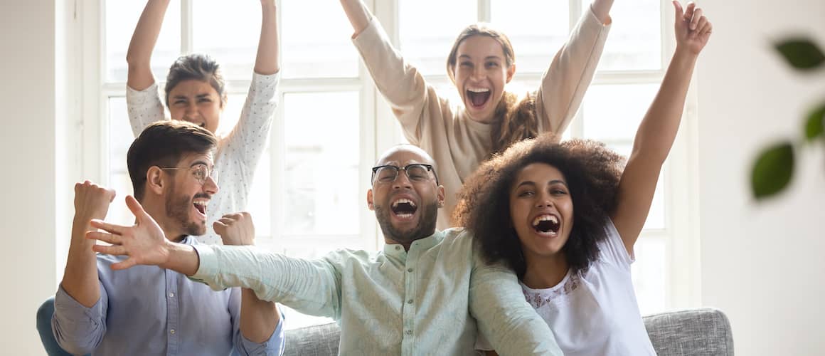 group of friends celebrating during the Superbowl